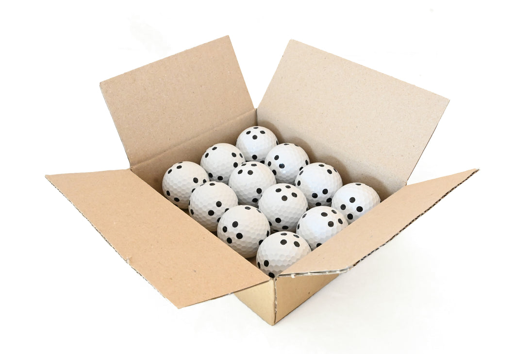 NVISAGE marked golf balls on a hitting mat