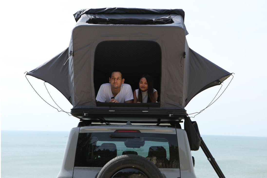 Comfortable sleeping space inside the TOPOAK Stellar rooftop tent with campers inside